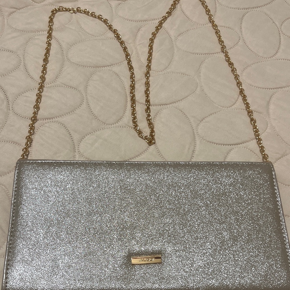 Aldo Glittery Silver Clutch with Gold Chain